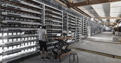 Modern mining farm hosting multiple rigs for cryptocurrency mining