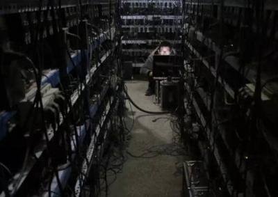 A vast mining farm with numerous rigs operating in a climate-controlled environment.